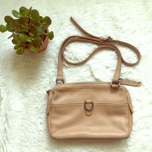 Lucky brand crossbody purse light tan in color